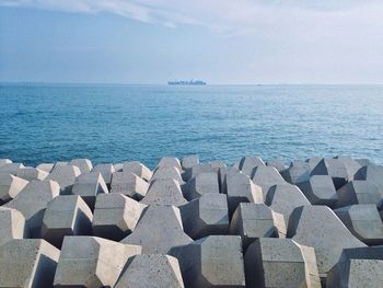 Distant view of ship in sea against sky