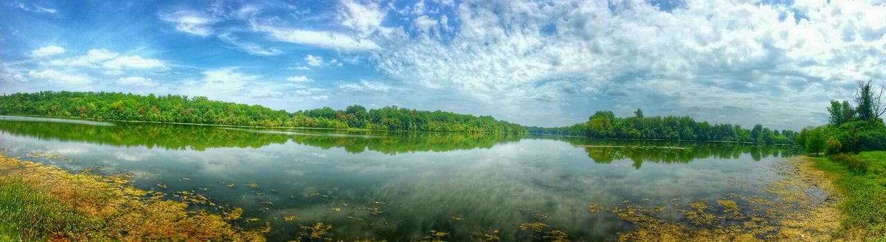 reflection, tranquil scene, lake, tranquility, water, scenics, sky, beauty in nature, tree, nature, cloud - sky, standing water, idyllic, cloud, calm, blue, non-urban scene, symmetry, growth, outdoors