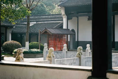 Statue against trees