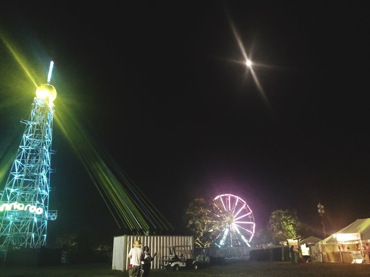 ILLUMINATED FERRIS WHEEL AT NIGHT