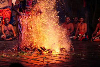 People enjoying in water at night