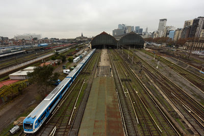 High angle view of railroad tracks in city against sky