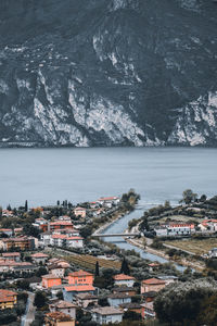 High angle view of townscape by sea