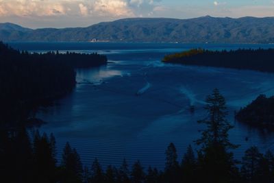 Scenic view of lake against sky during winter