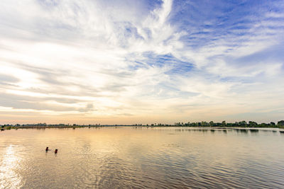 Scenic view of sea against sky at sunset