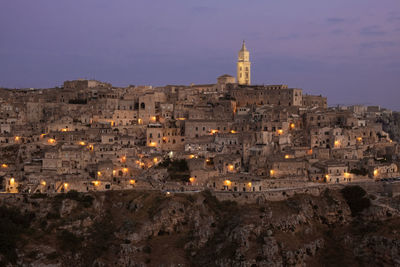 Buildings in city at dusk