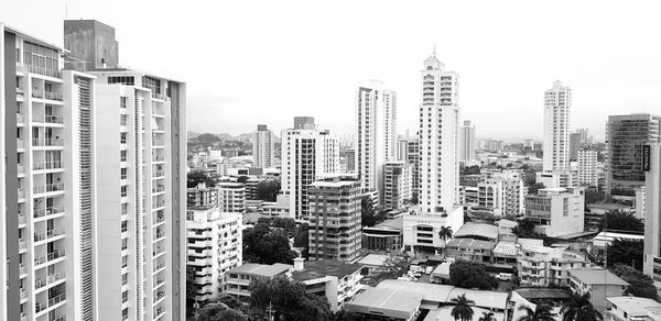 High angle view of buildings in city against sky