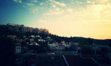 Town against cloudy sky