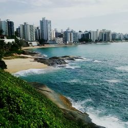 View of sea with city in background