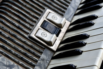 High angle view of accordion with buttons