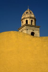 Low angle view of building against clear blue sky