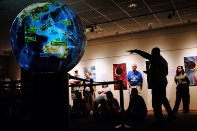 People standing in illuminated room