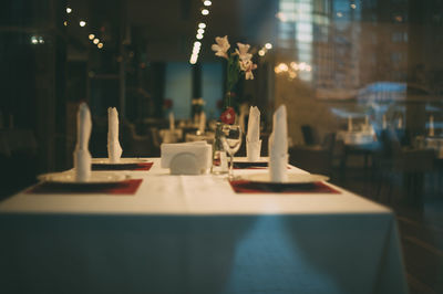 Close-up of chairs and table at restaurant