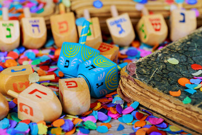 Close-up of colorful confetti on table during hanukkah