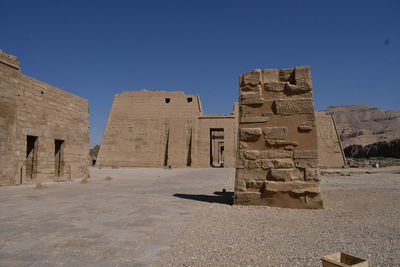 Old ruins of temple against clear sky