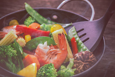 Close-up of vegetables in cooking pan on table