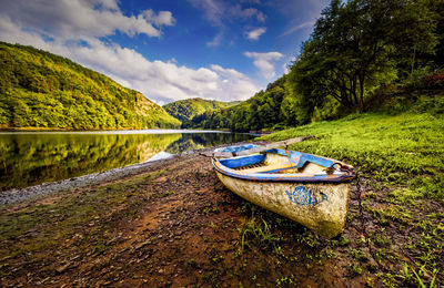 Boat on the river bank of vltava in czech republic, stechovice 26 km south of prague.