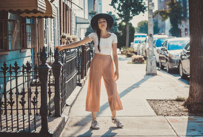 Portrait of woman on street in city