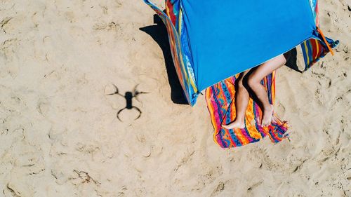 Multi colored umbrellas on sand at beach