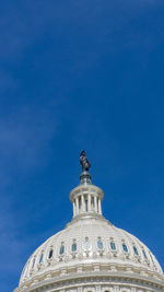 Low angle view of building against blue sky