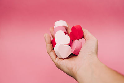 Close-up of hand holding heart shape