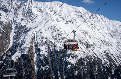 Family in the ski area in tirol in the chair lift