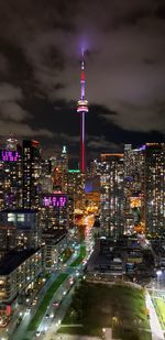 High angle view of city lit up at night