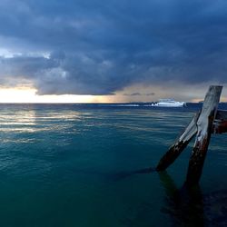 Scenic view of sea against sky at sunset