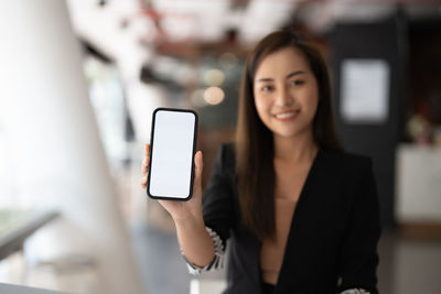 Young woman using mobile phone
