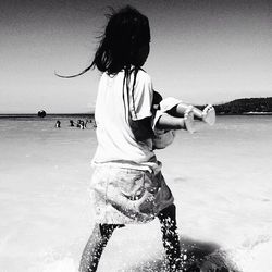 Woman standing in water