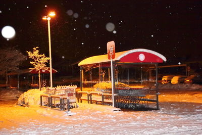 Illuminated built structure at night during winter