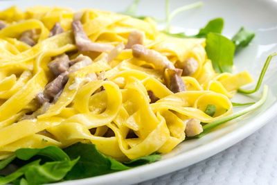 Close-up of tagliatelle served in plate on table