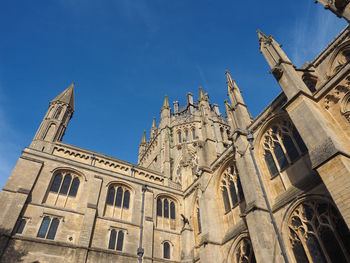 Low angle view of building against blue sky