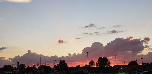 Panoramic view of silhouette city against sky during sunset