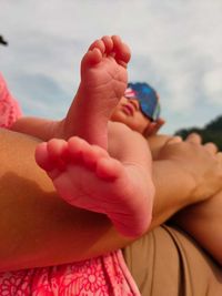 Low section of baby feet