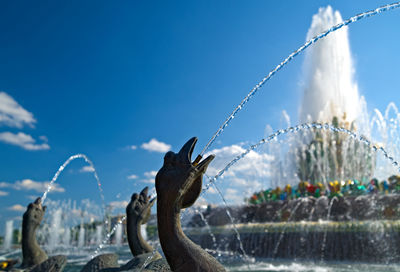 Close-up of fountain against blue sky
