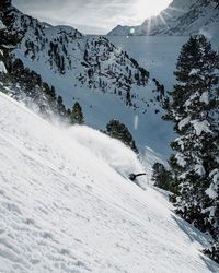 Scenic view of snow covered mountains against sky