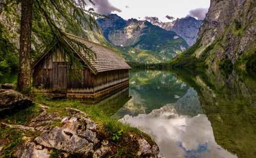 Scenic view of lake and mountains against sky