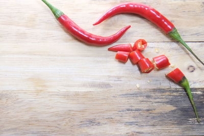 High angle view of red chili peppers on table