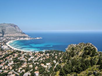 Scenic view of sea against clear blue sky