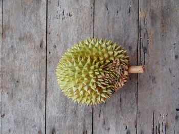 Durian the king of fruits with wooden background.