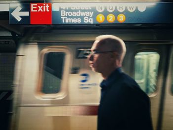 Blurred motion of train at railroad station