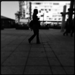 Woman walking in city