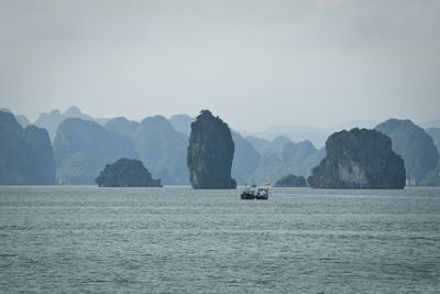 Scenic view of sea with mountains in background