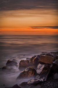 Scenic view of sea against sky during sunset