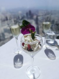 Close-up of wine glasses on table