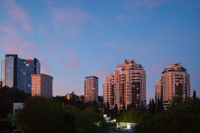 Buildings in city against sky