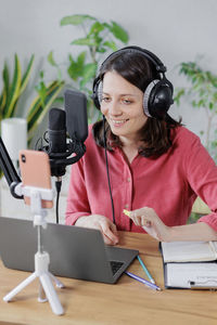 Portrait of woman using mobile phone