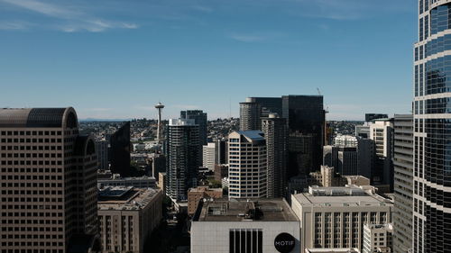 Modern buildings in city against sky