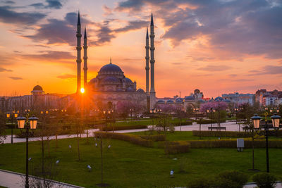 Buildings against sky during sunset